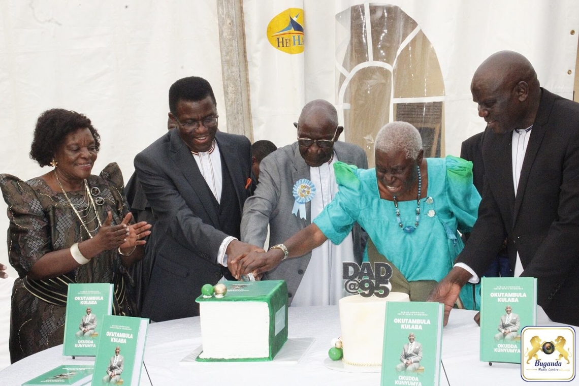 Cutting the cake during the 95th birthday celebration.